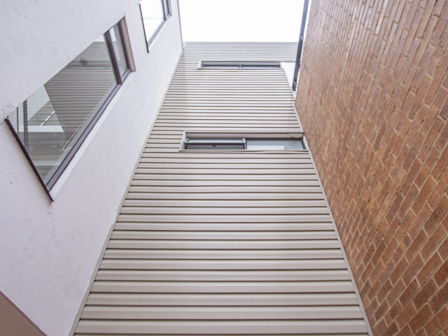 Building made with arkosiding h